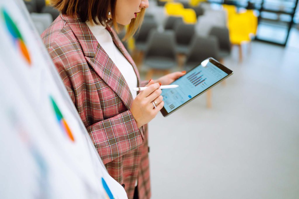 Young woman leader, presenter, make a business presentation at a conference in the office.