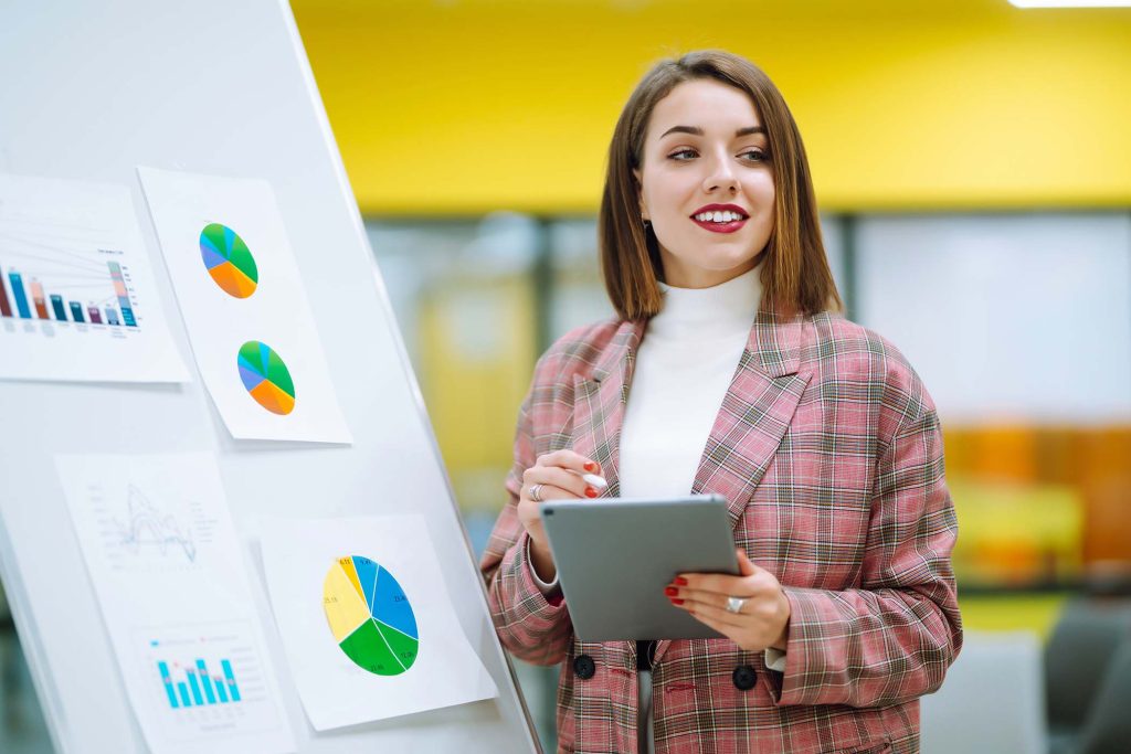 Young woman leader, presenter, make a business presentation at a conference in the office.