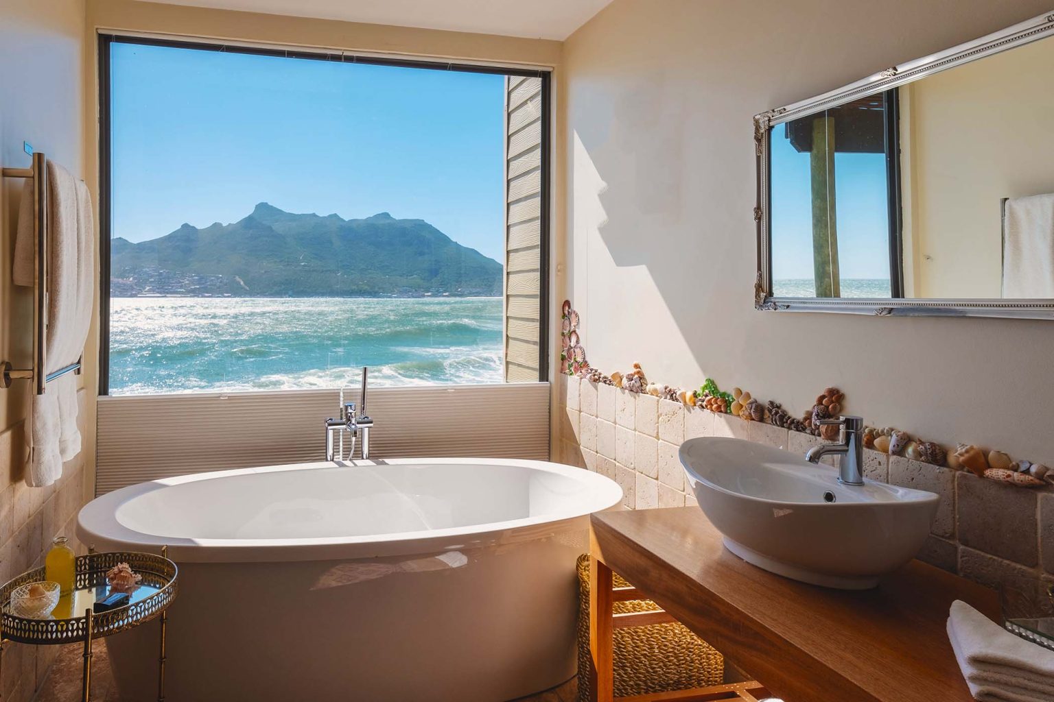 bathtub looking out over the ocean of Cape Town South Africa during vacation. Bath Tub during sunset, jacuzzi on vacation