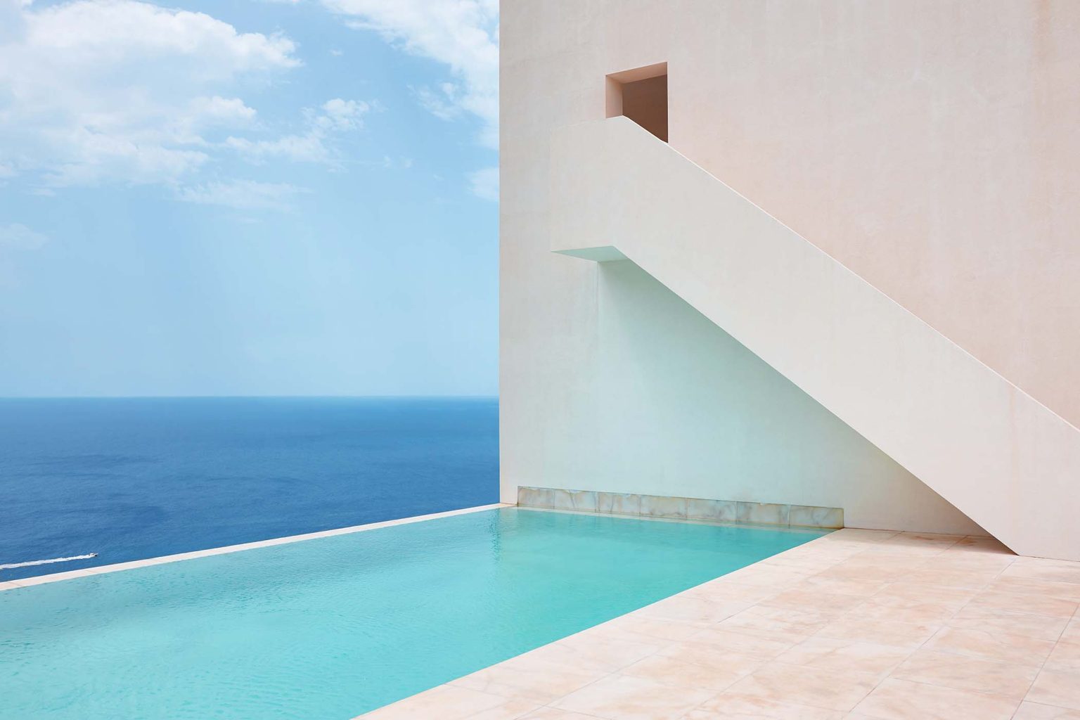 White geometric building facade in spanish coastline. Mediterranean sea. Spain