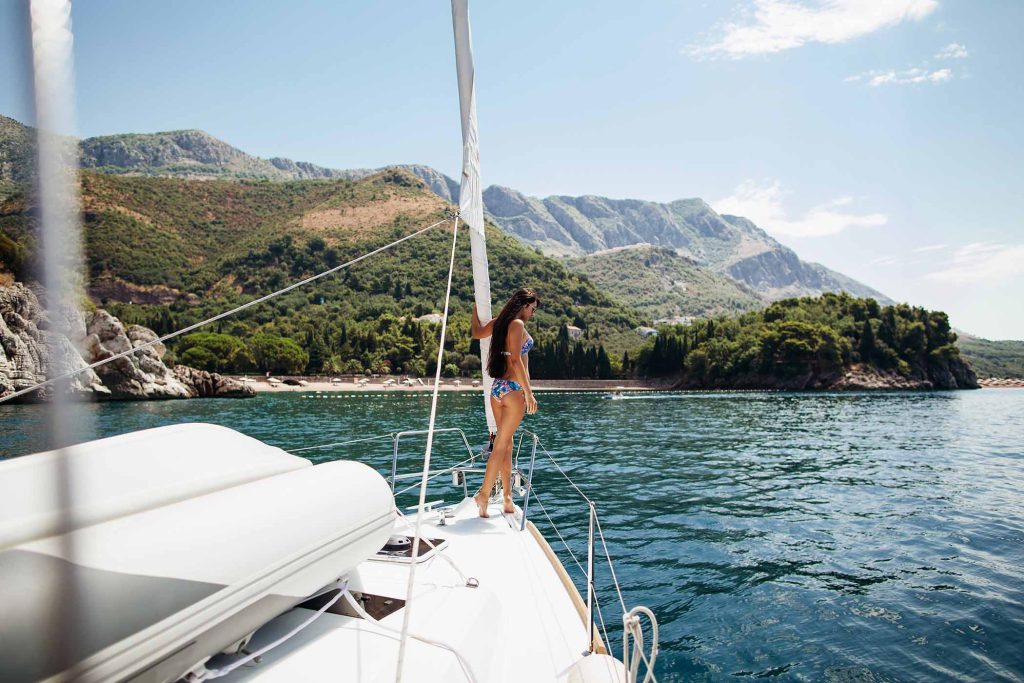 sexy long hair girl in swimwear on yacht in Montenegro