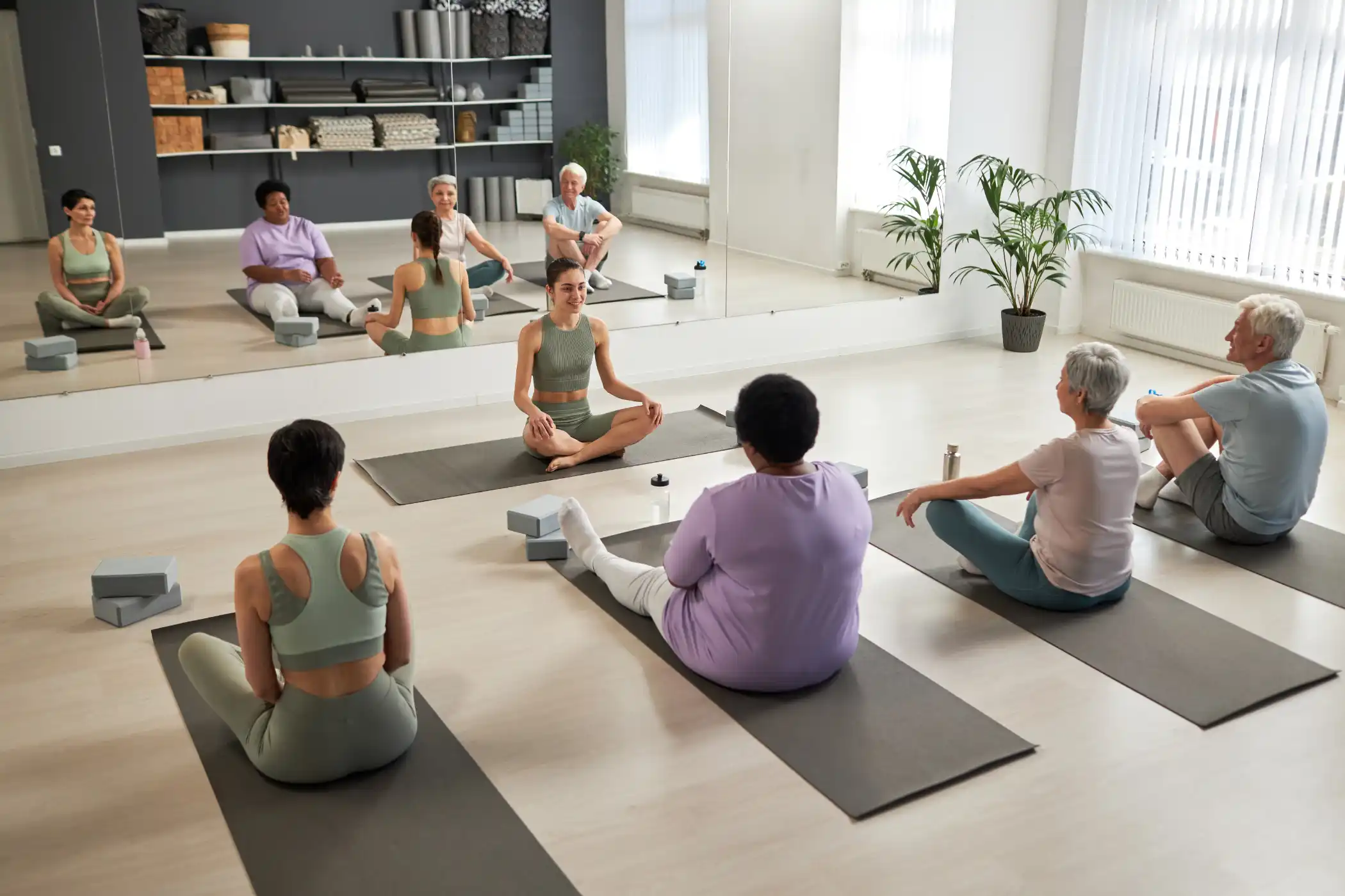 people-exercising-in-yoga-studio-29YA8U9