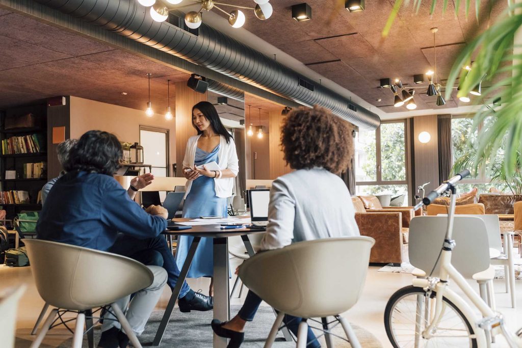 Italy, Business people having meeting in creative studio